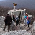 MCM members enjoying the view atop a large rock formation